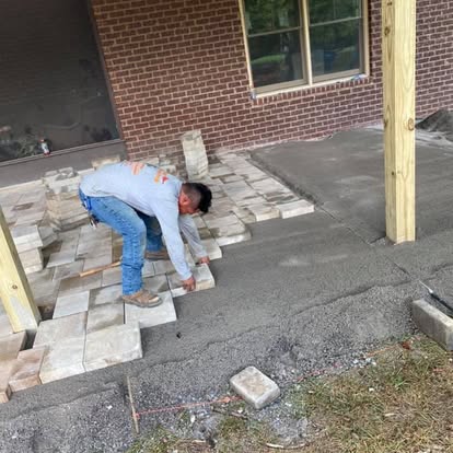 Cardinal crew installing patio pavers